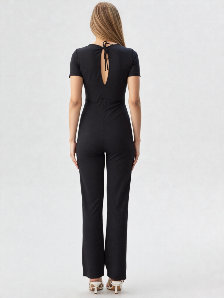 A woman showing rhe back of her breastfeeding friendly one piece