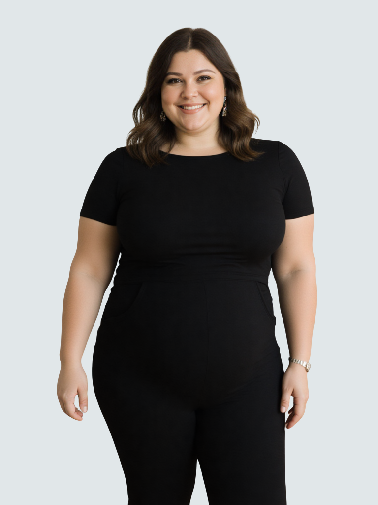 A woman wearing a comfortable black nursing jumpsuit