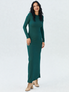 Happy woman wearing emerald green dress with subtle breastfeeding access